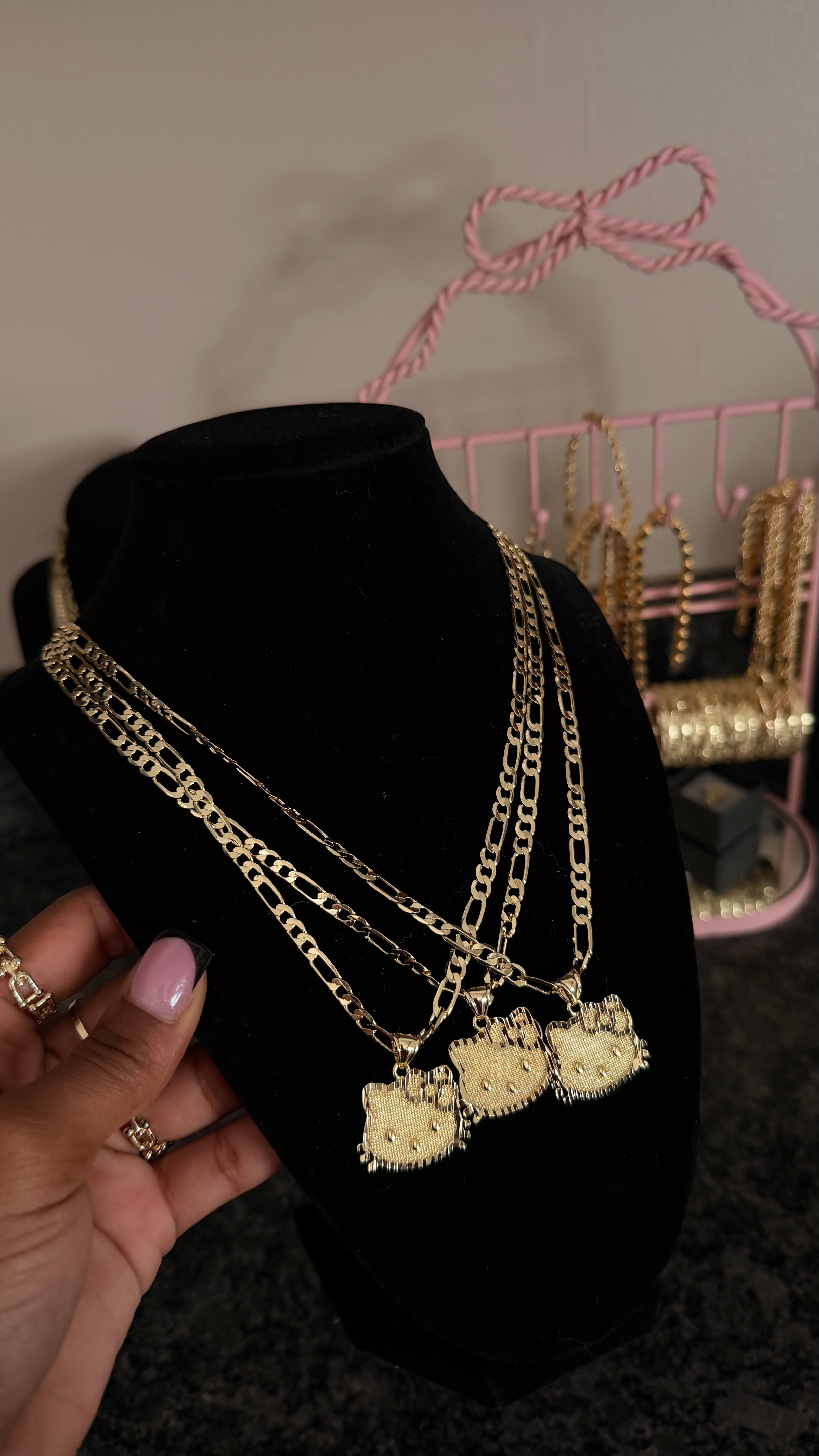 hk face pendant + figaro chain image 0